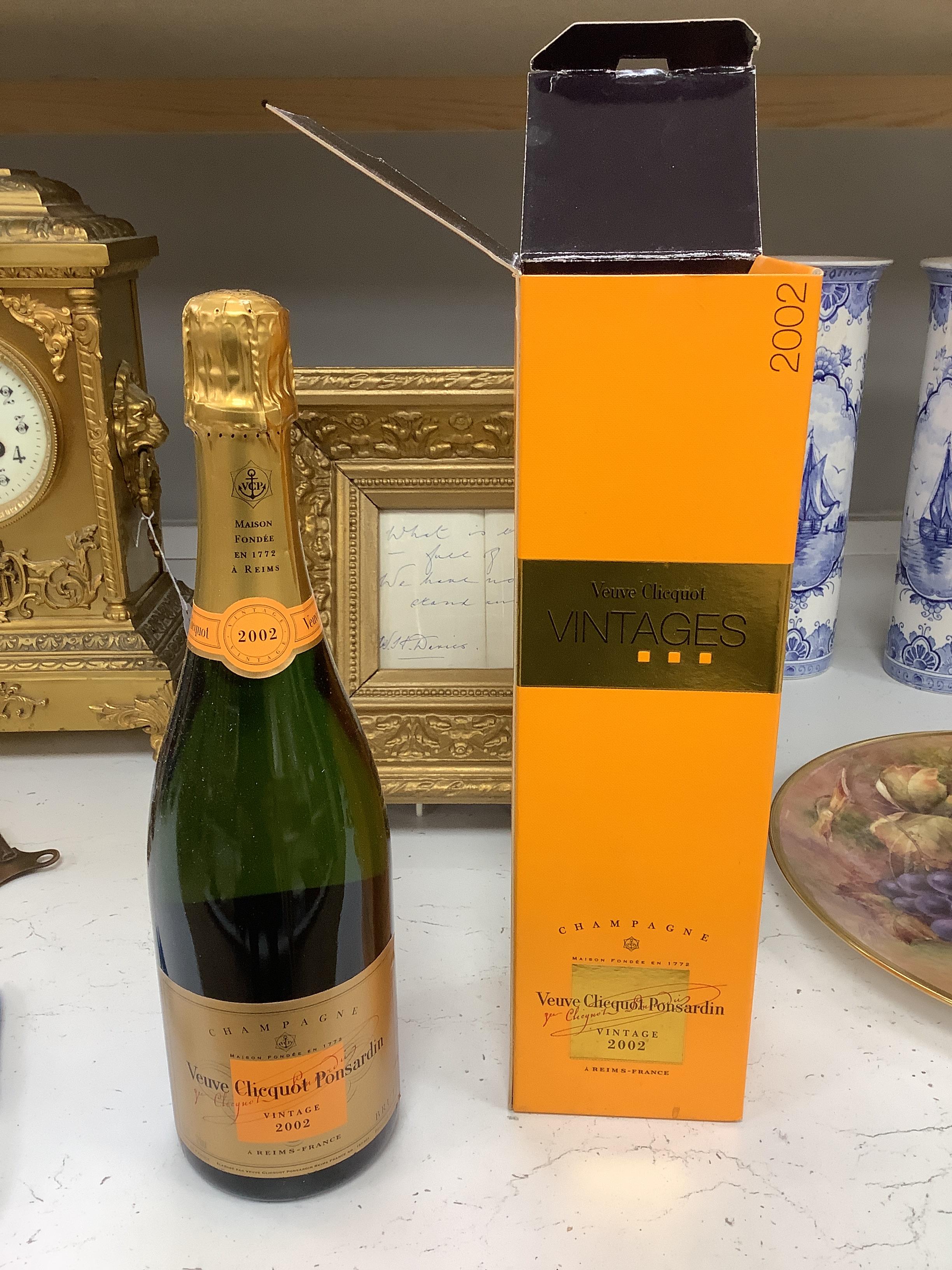 Three bottles of champagne including 2003 Bollinger, boxed